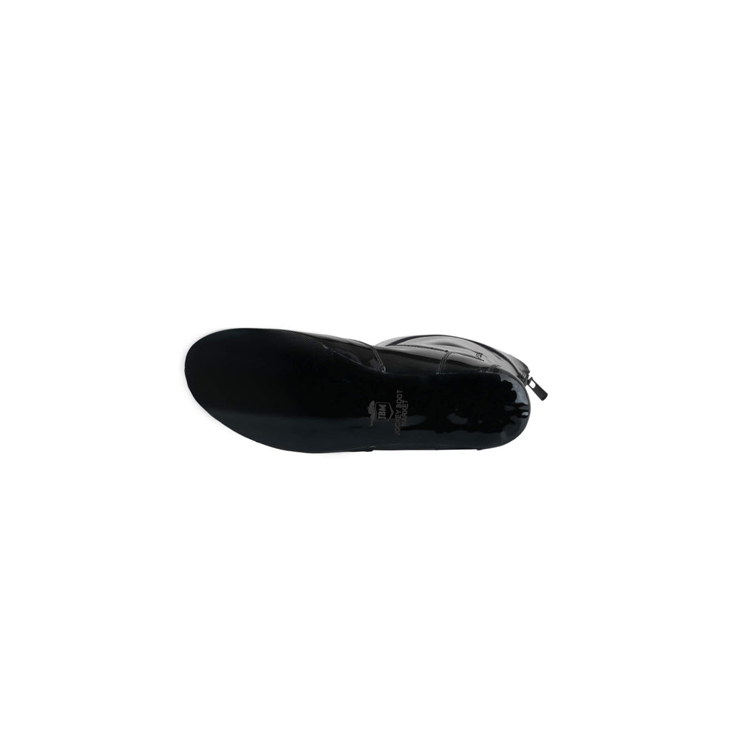 A single tall racing boot laid down to showcase the sole, displayed against a white background. The boot is made of black shiny material. It features a back zip and a 1.5-2cm stretch feature around the calf.