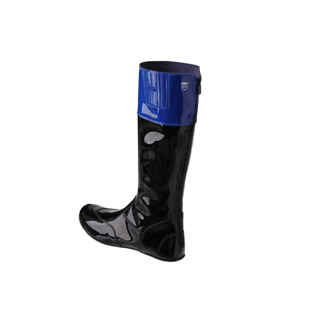 A single tall racing boot displayed against a white background. The boot is made of black material with blue patent leather accent around the calf. It features a back zip and a 1.5-2cm stretch feature around the calf area. The boot is shown from a side-back perspective.