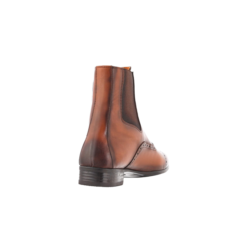 A back view of a brown patina leather wingtip style boot, displayed against a white background.
