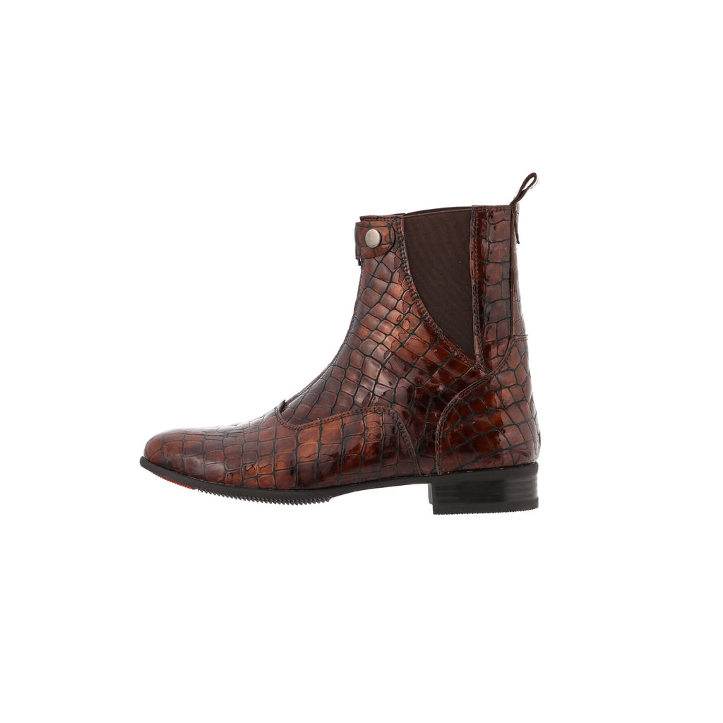 A side view of a brown crocodile boot with a front zip and buckle closure, displayed against a white background.
