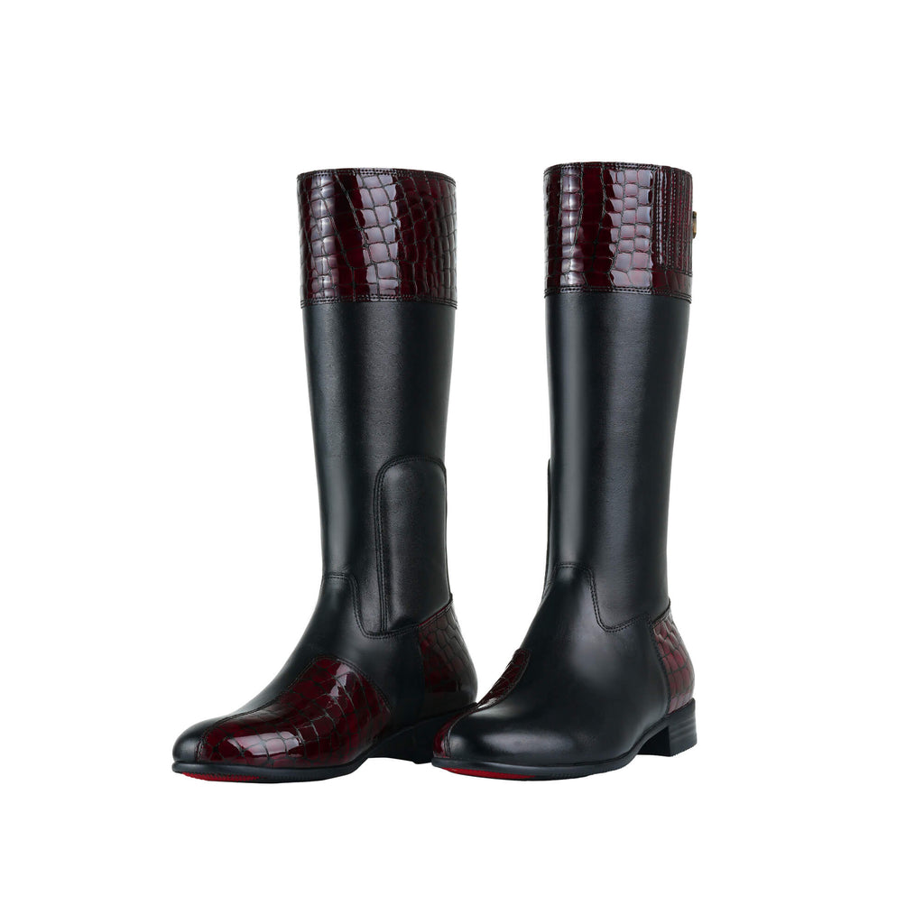 A pair of black leather tall boots with burgundy textured accents on the top and bottom. Features a back zip and a 1.5 - 2cm ability to loosen the calf area if required. Displayed against a white background with the soles down. The zips are done, and the boots are slightly positioned to one side.
