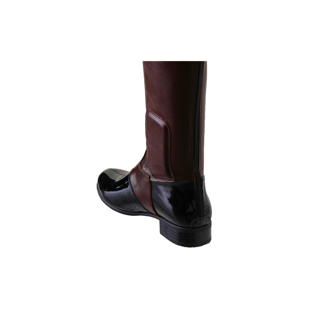 A side-back view of a brown tall boot with black patent accents on the top and bottom. Features a back zip and a 1.5 - 2cm ability to loosen the calf area if required. Displayed against a white background.