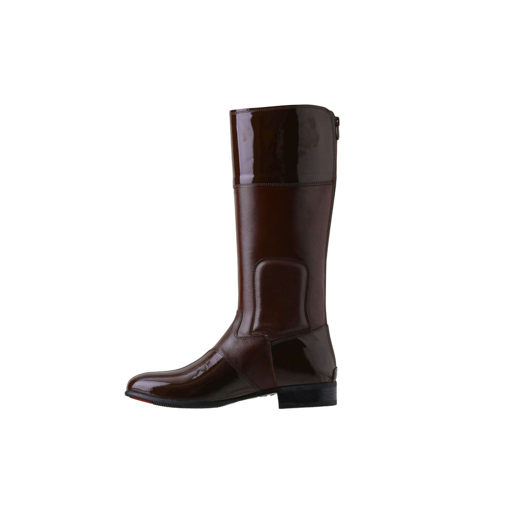 A single tall racing boot displayed against a white background. Made of brown leather with brown patent leather wrapping around the calf, it features a back zip and a 1.5-2cm stretch feature on the calf area. The boot is shown from a side perspective.