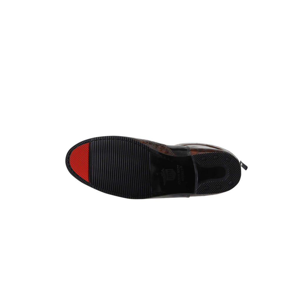 A single tall boot laid down against a white background. The boot features black patent leather with brown crocodile accents. It has a back zip and a 1.5-2cm stretch feature on the calf area. The image showcases the sole of the boot, which features a red tip design.