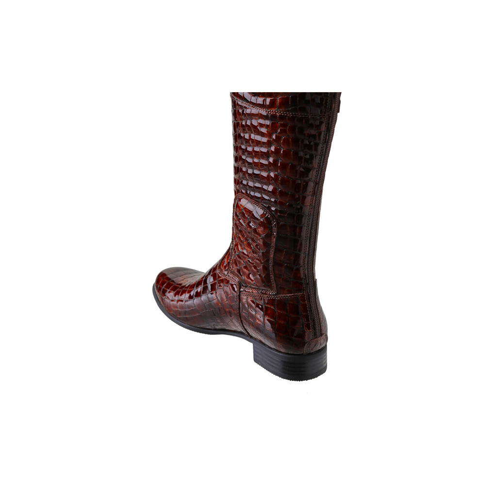 A brown crocodile tall boot featuring a back zip and a 1.5 - 2cm ability to loosen the calf area if required. Displayed against a white background. The image shows one boot from a side back perspective, with the zip done.