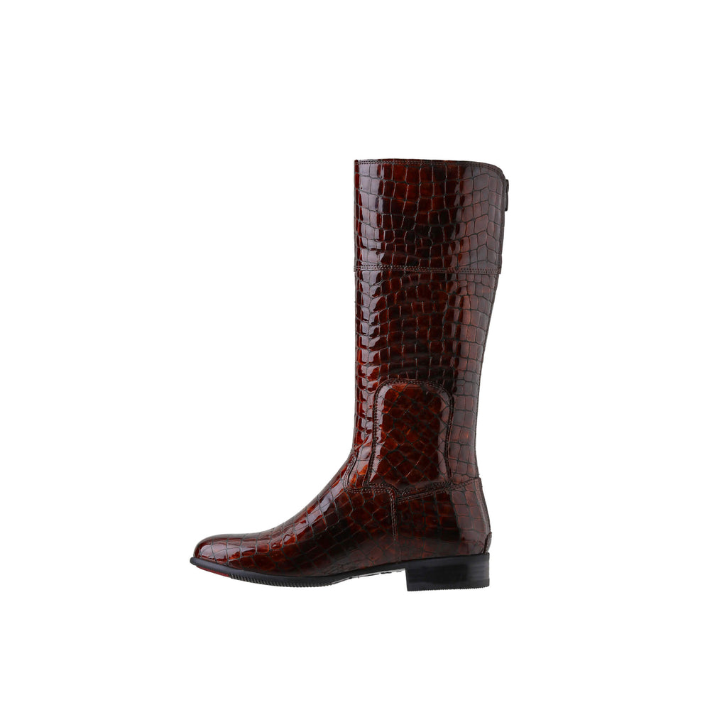 A brown crocodile tall boot featuring a back zip and a 1.5 - 2cm ability to loosen the calf area if required. Displayed against a white background. The image shows one boot from a side perspective, with the zip done.