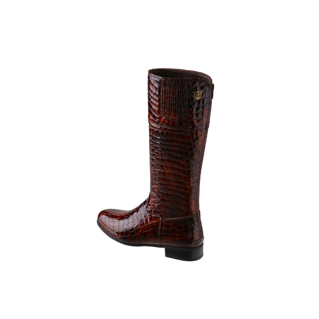 A brown crocodile tall boot featuring a back zip and a 1.5 - 2cm ability to loosen the calf area if required. Displayed against a white background. The image shows one boot from a side back perspective, with the zip done.