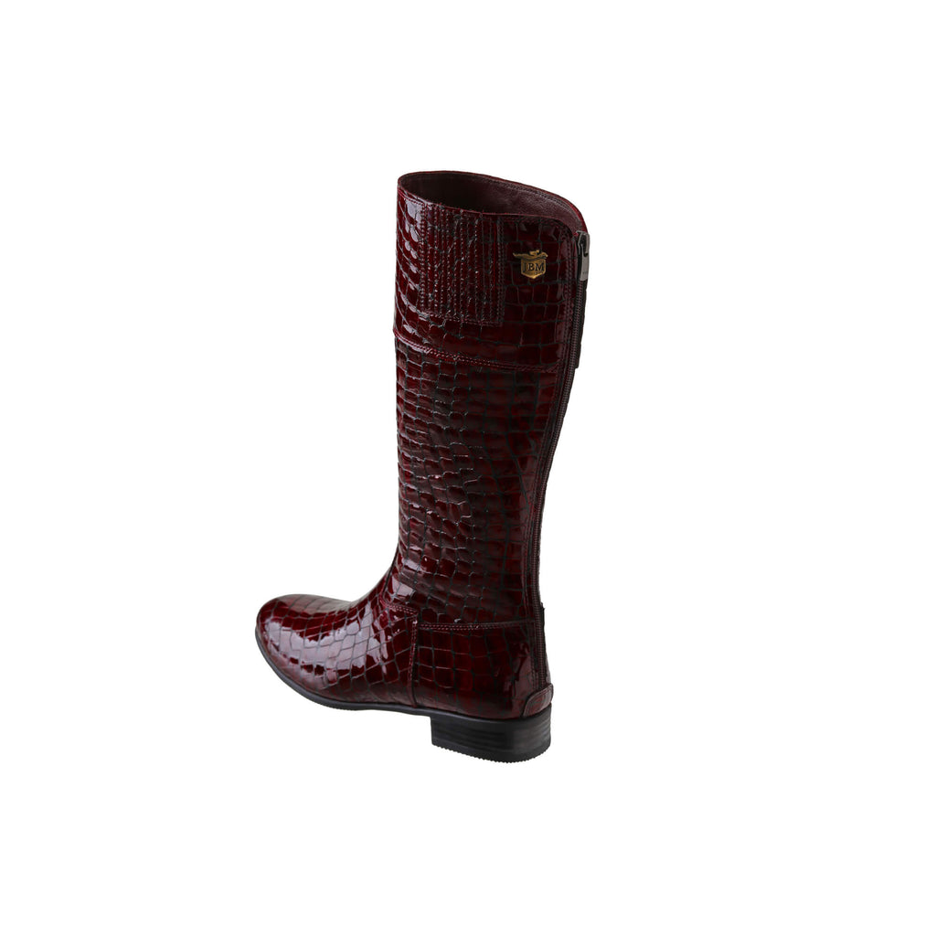 Image of a tall burgundy crocodile boot displayed against a white background. The boot features a back zip and a 1.5-2cm stretch feature on the calf area. This image only showcases one boot from a side-back perspective.