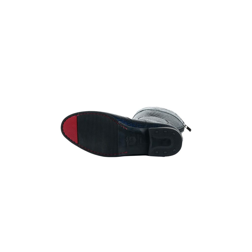 An obsidian blue crocodile textured tall boot. Features a back zip and a 1.5 - 2cm ability to loosen the calf area if required. Displayed sole up to showcase the red tip design on the sole. White background.
