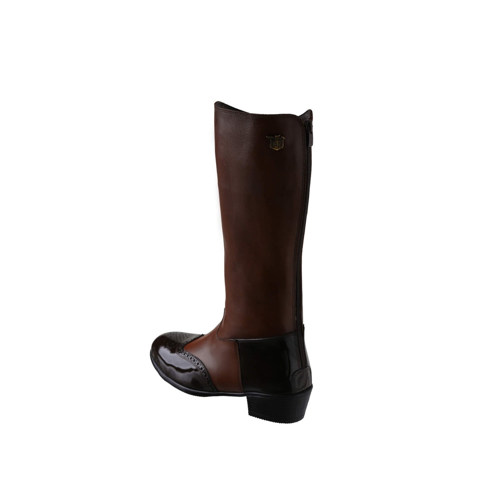 A tall brown leather Cuban heel boot with brown wingtip accents displayed against a white background. The image showcases only one boot from a side-back perspective, featuring a back zip.